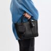 Bolsillo con clip en Signature Canvas