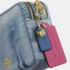 Bolso bandolera Carey en denim desgastado con Charms