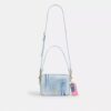 Bolso bandolera Carey en denim desgastado con Charms