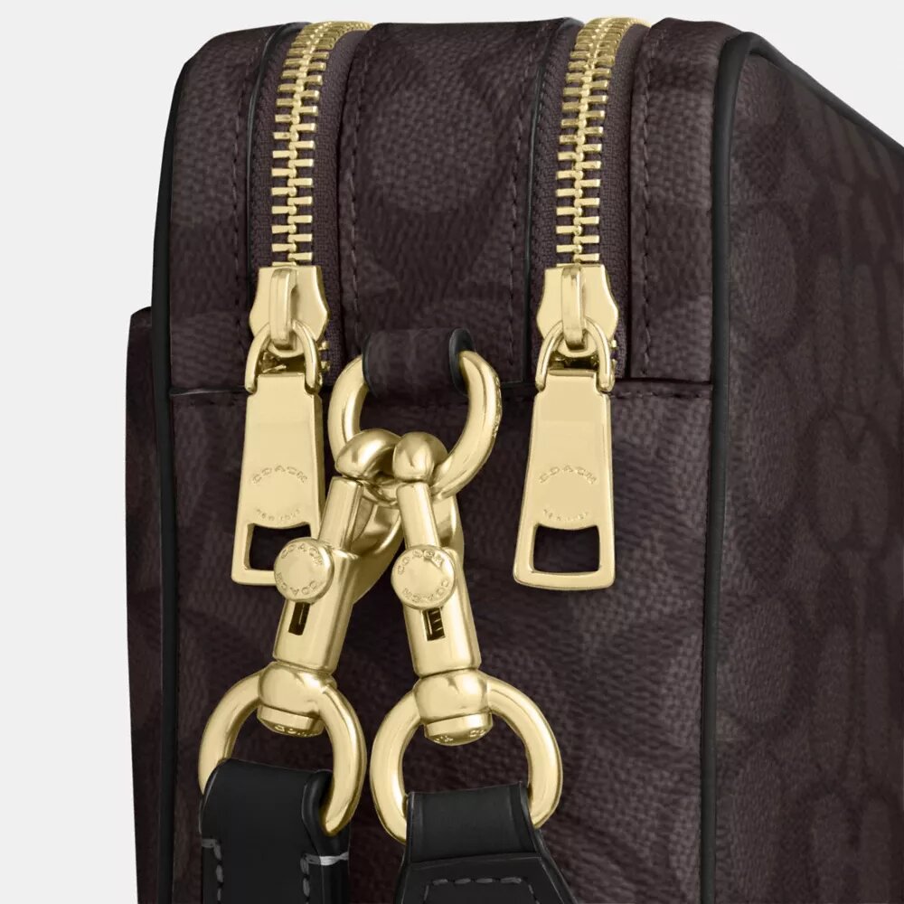 Bolso bandolera Carey en Signature Canvas