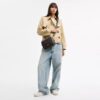 Bolso bandolera Carey en Signature Canvas