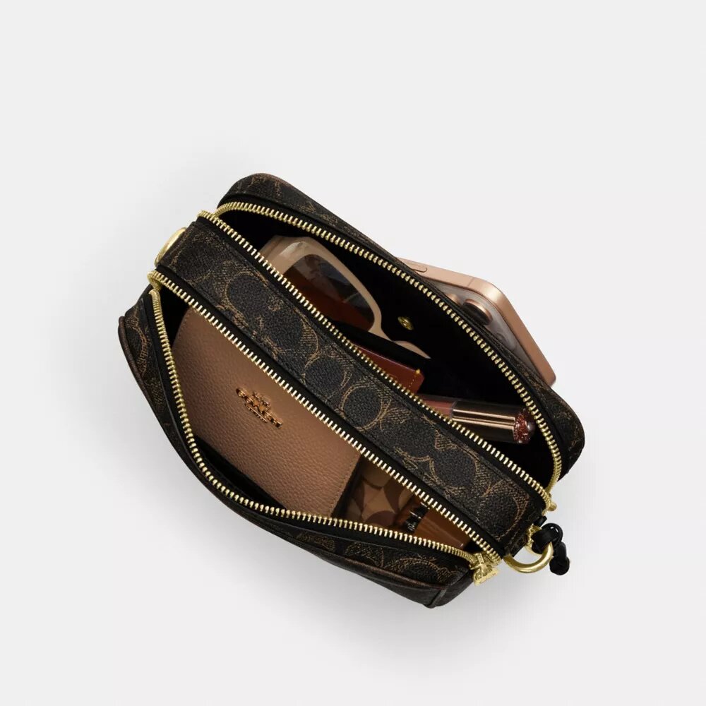 Bolso bandolera Carey en Signature Canvas con Charms