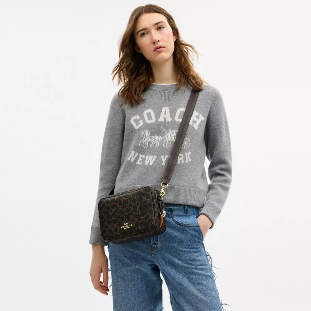 Bolso bandolera Carey en Signature Canvas con Charms