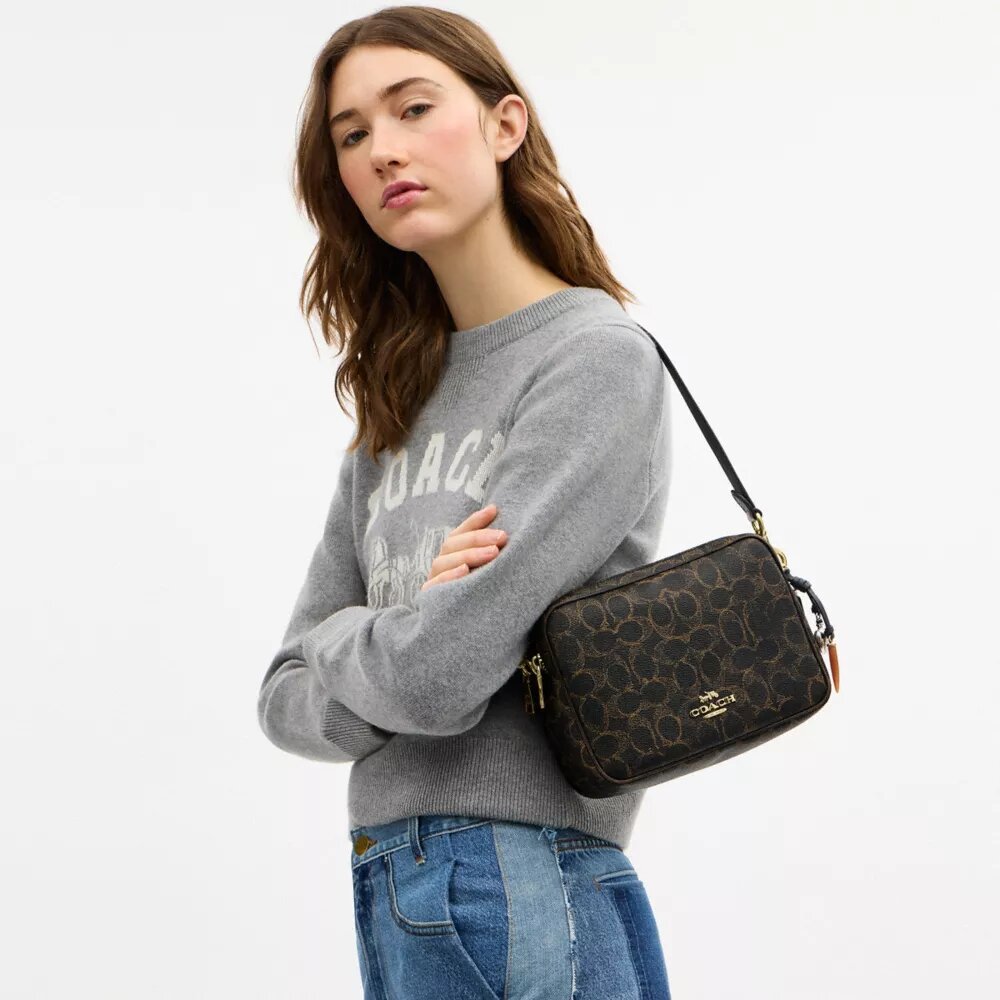 Bolso bandolera Carey en Signature Canvas con Charms