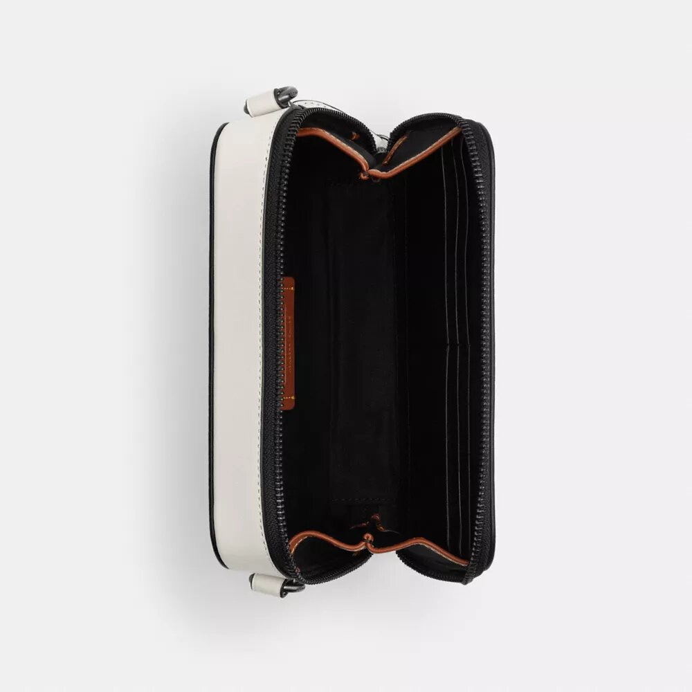 Bolso bandolera Charter Slim en Signature Canvas