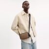 Bolso bandolera Colton 19 en Signature Canvas