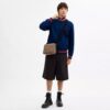 Bolso bandolera Colton 25 en Signature Canvas