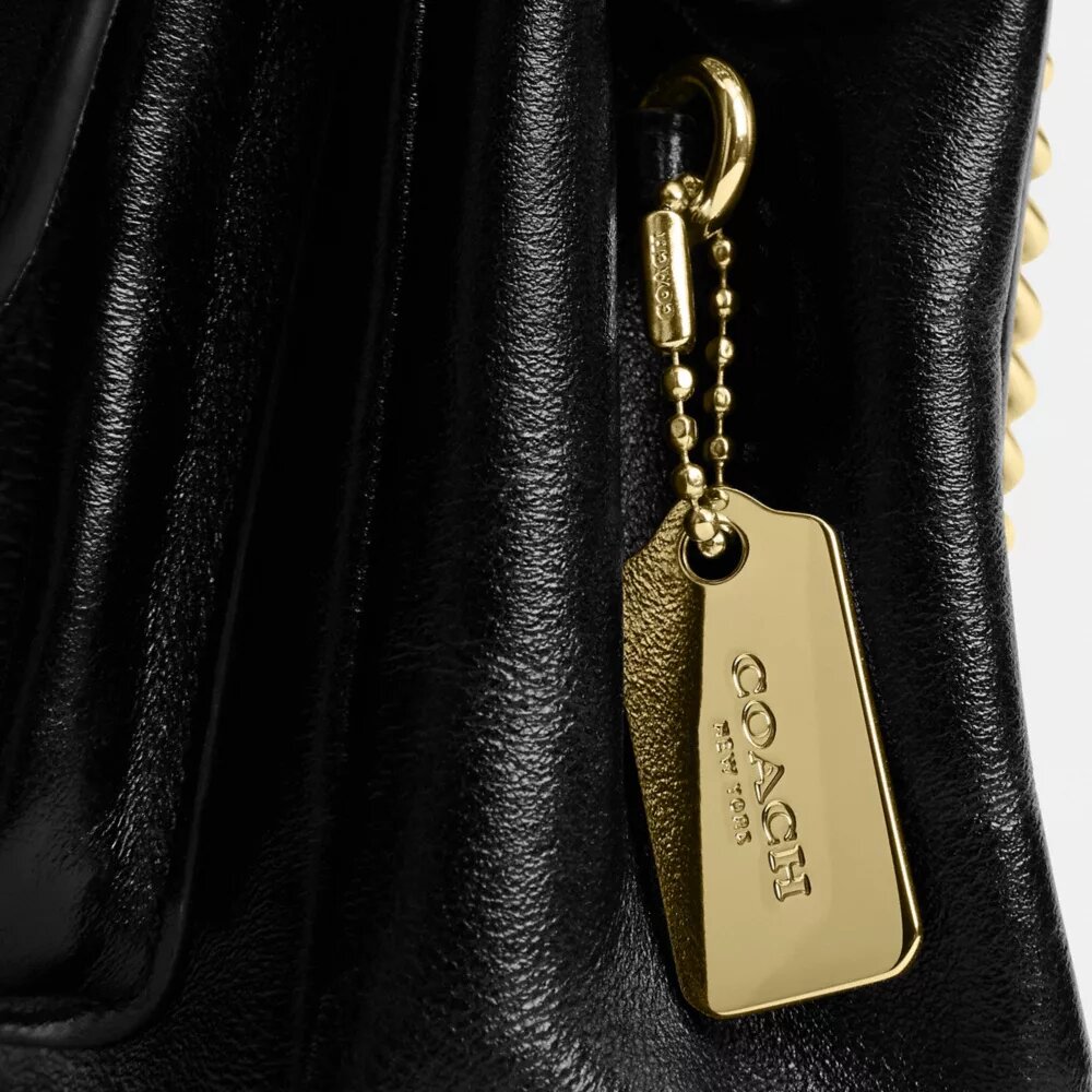 Bolso bandolera Elodie 18 en Signature Canvas