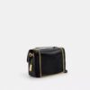 Bolso bandolera Elodie en Signature Canvas