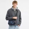 Bolso bandolera Graham con estampado de camuflaje característico