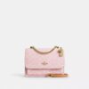 Bolso bandolera Klare en Signature Canvas con Charms