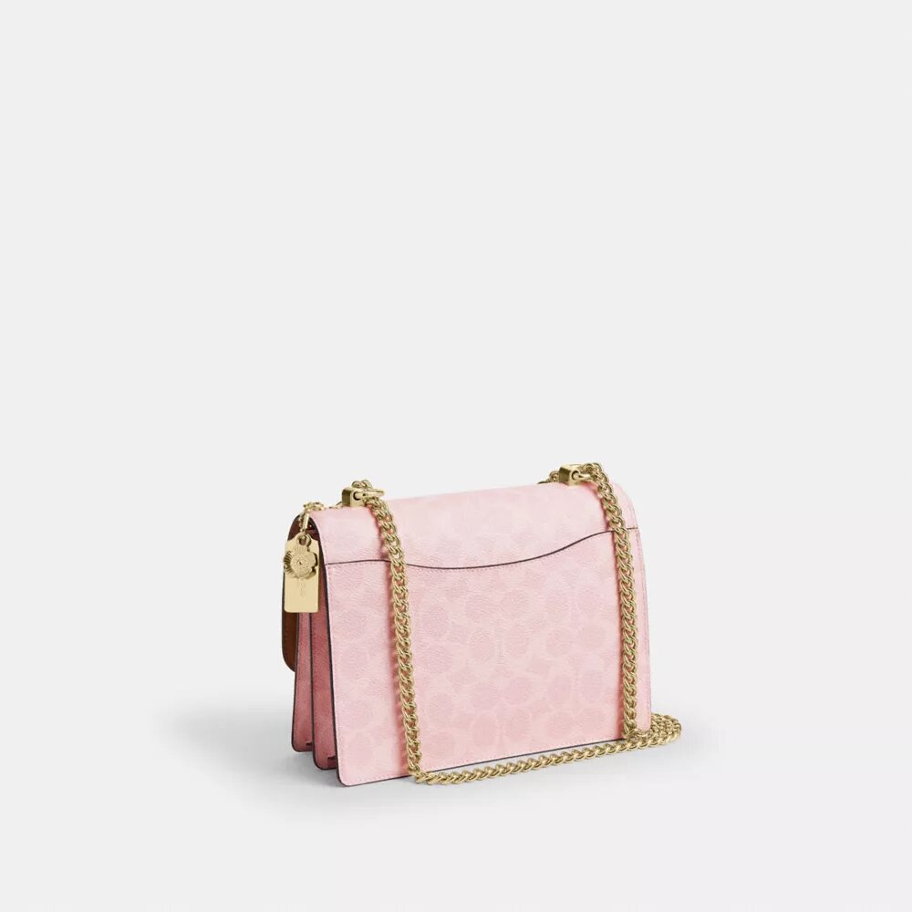 Bolso bandolera Klare en Signature Canvas con Charms