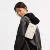 Bolso bandolera Mila con Signature Canvas