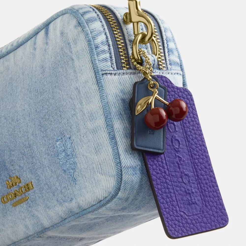 Bolso bandolera Mini Carey en denim desgastado con Charms