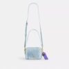 Bolso bandolera Mini Carey en denim desgastado con Charms
