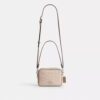 Bolso bandolera Mini Carey en Signature Canvas