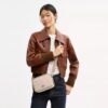 Bolso bandolera Mini Carey en Signature Canvas
