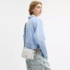 Bolso bandolera Mini Carey en Signature Canvas