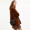Bolso bandolera Mini Carey en Signature Canvas
