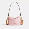 Bolso bandolera Mini Carey en Signature Canvas con Charms