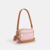 Bolso bandolera Mini Carey en Signature Canvas con Charms