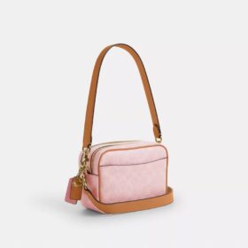 Bolso bandolera Mini Carey en Signature Canvas con Charms