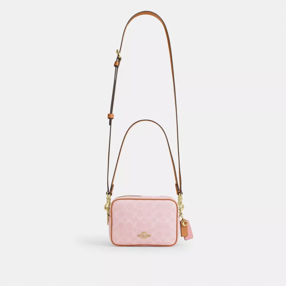 Bolso bandolera Mini Carey en Signature Canvas con Charms