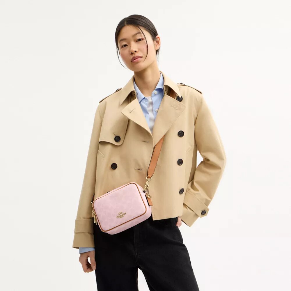 Bolso bandolera Mini Carey en Signature Canvas con Charms