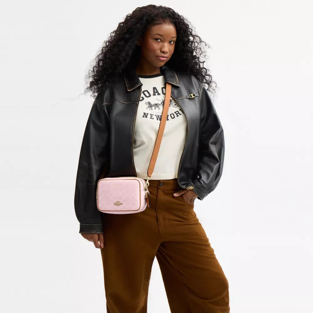 Bolso bandolera Mini Carey en Signature Canvas con Charms