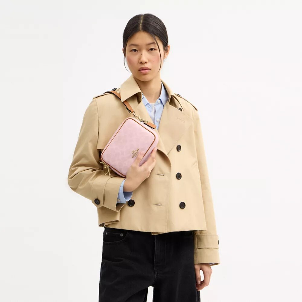 Bolso bandolera Mini Carey en Signature Canvas con Charms