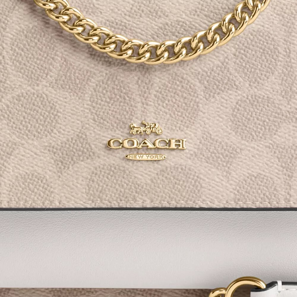 Bolso bandolera Mini Klare en Signature Canvas