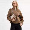 Bolso bandolera Mini Klare en Signature Canvas