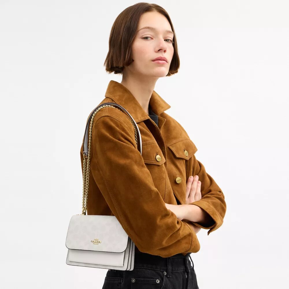 Bolso bandolera Mini Klare en Signature Canvas