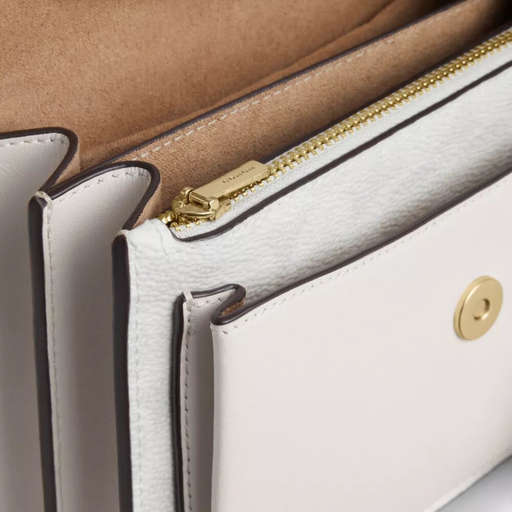 Bolso bandolera Mini Klare en Signature Canvas