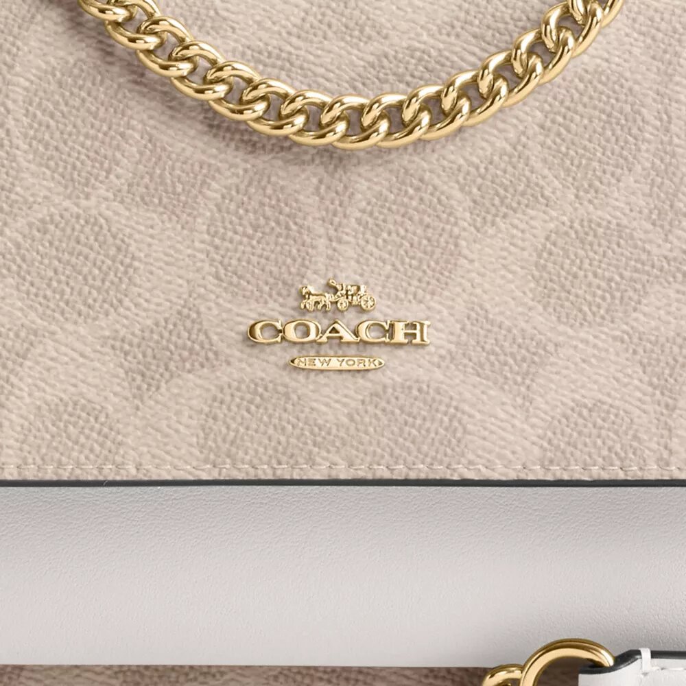 Bolso bandolera Mini Klare en Signature Canvas