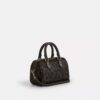 Bolso bandolera Mini Rowan en Signature Canvas con Charms