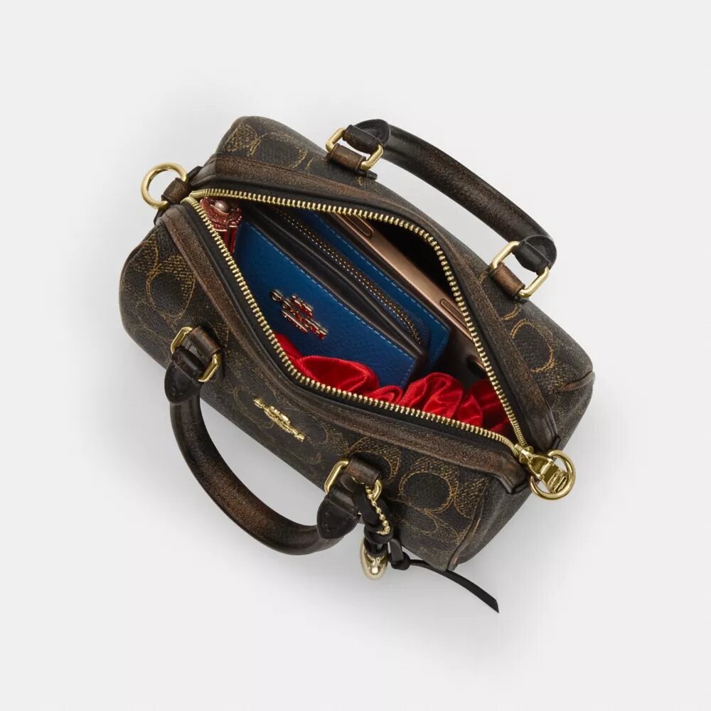 Bolso bandolera Mini Rowan en Signature Canvas con Charms