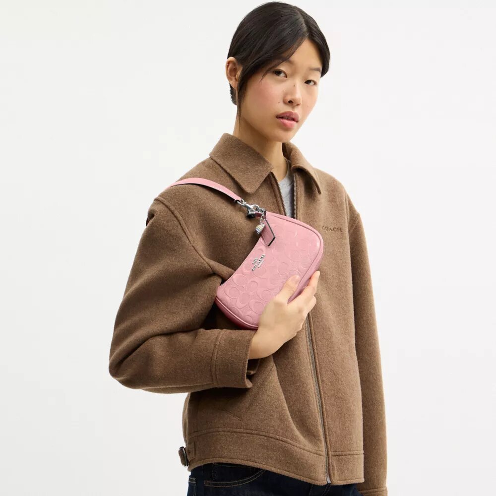 Bolso bandolera mini Teri en piel exclusiva con colgante de corazón