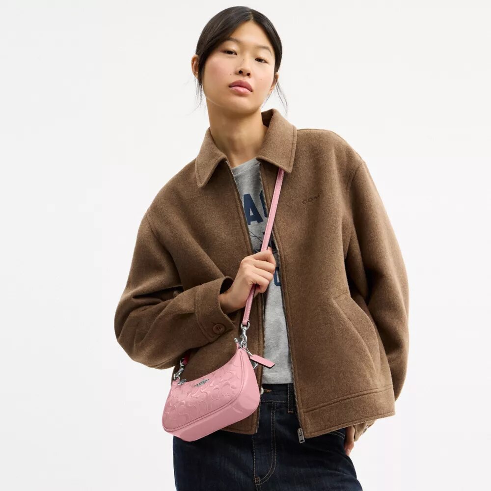 Bolso bandolera mini Teri en piel exclusiva con colgante de corazón