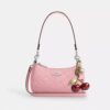Bolso bandolera mini Teri en piel exclusiva con colgante de corazón