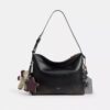 Bolso bandolera Mott 38 en cuero desgastado con Charms