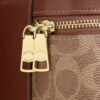 Bolso bandolera Rainer 18 en Signature Canvas