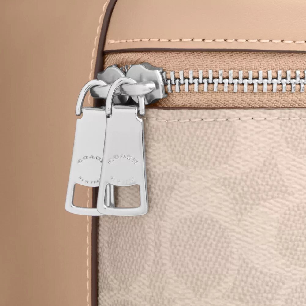 Bolso bandolera Rainer 18 en Signature Canvas