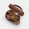 Bolso bandolera Rainer 18 en Signature Canvas