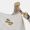 Bolso bandolera Teri Mini en Signature Canvas