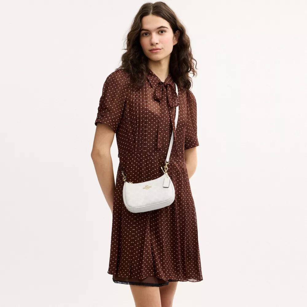 Bolso bandolera Teri Mini en Signature Canvas