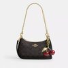 Bolso bandolera Teri Mini en Signature Canvas