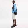 Bolso bandolera Tristan 14 en Signature Canvas