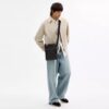 Bolso bandolera Tristan 22 en Signature Canvas