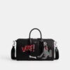 Bolso Compass 35 de Disney X Coach con Pluto
